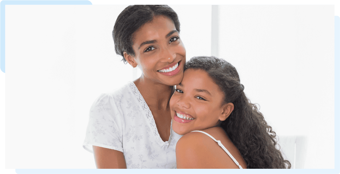 A mother and her daughter embracing each other
